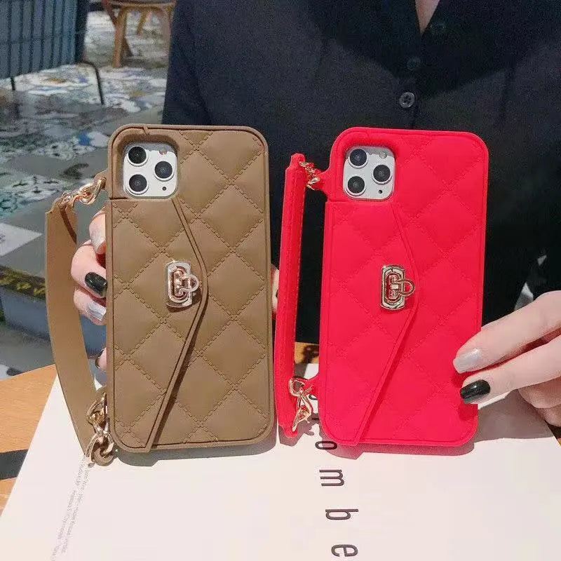 Luxury beige silicone iPhone case with a pearl chain lanyard attached, shown on an iPhone 13 Pro.