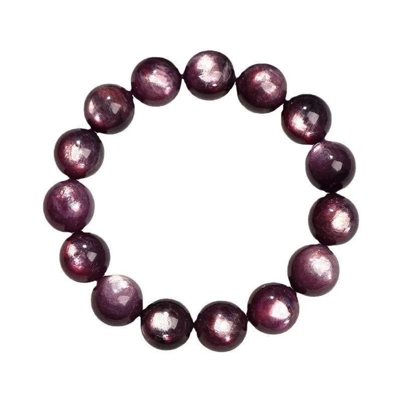 Natural purple lepidolite crystal round bead bracelet with adjustable cord on a wooden surface.