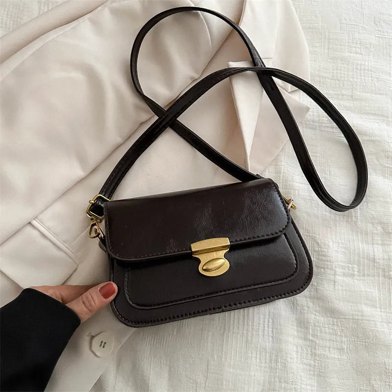 Retro square PU handbag in soft textured leather showing horizontal orientation and neutral colour options