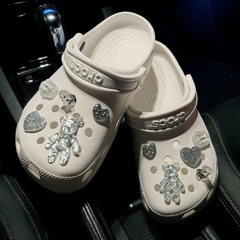 Crystal cloud bear shoe buckle set with resin, plush, and plastic details on a white background