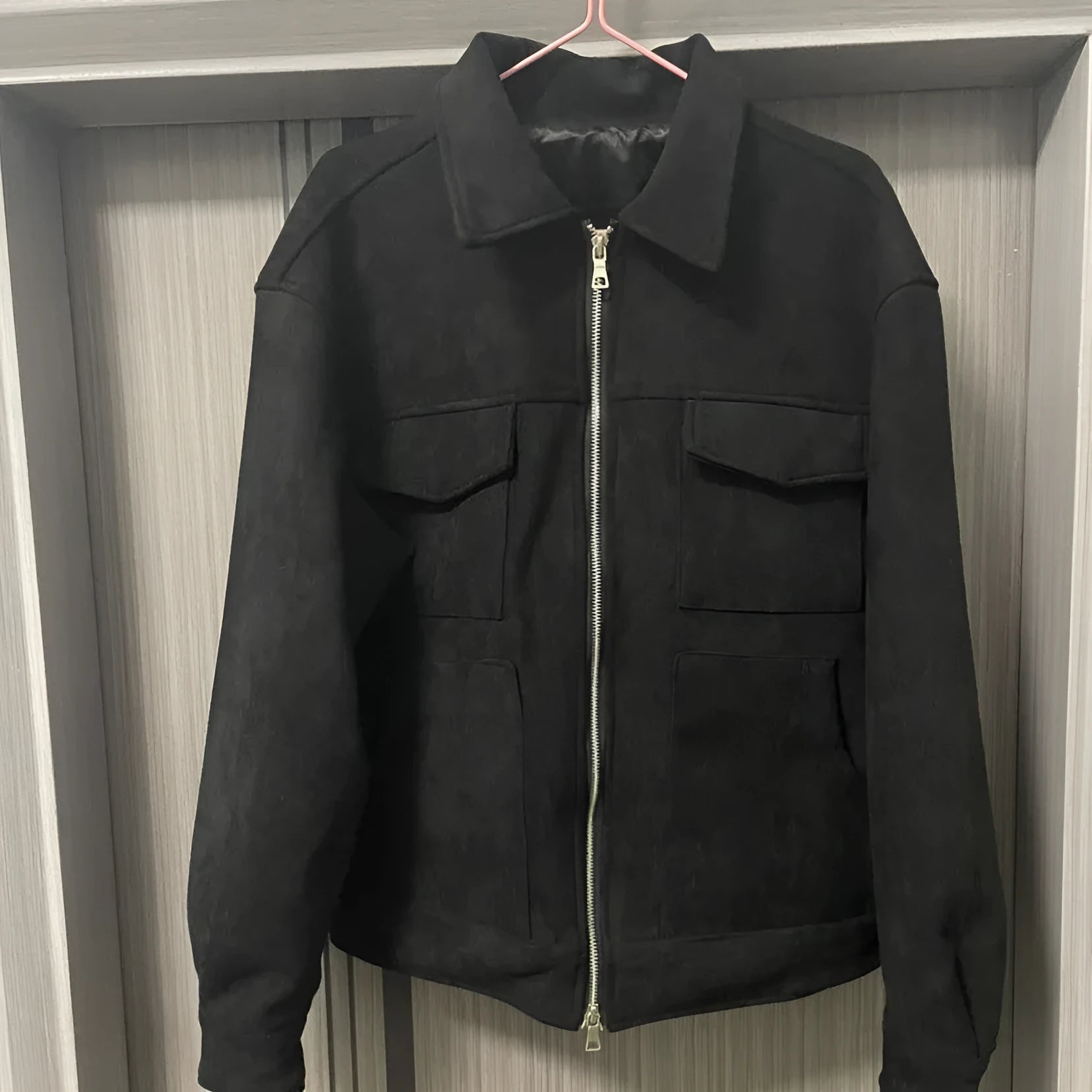 Men's slim fit black jacket with zipper and big pockets, also available in camel and dark grey.