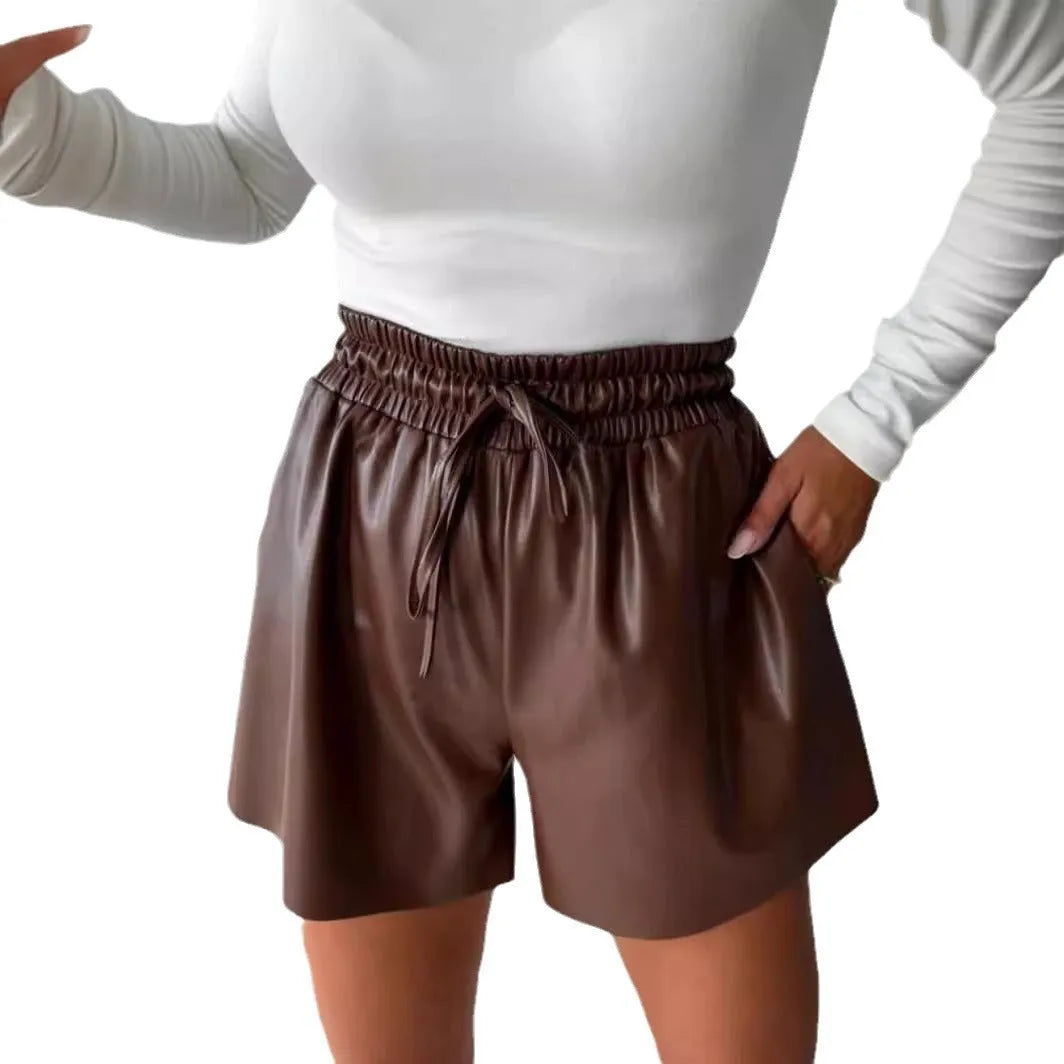 Black wide-leg women's shorts with a lace-up drawstring waist and a textured PU leather appearance.