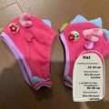 Pink polyester winter coat for small dog with optional hat on a French bulldog model