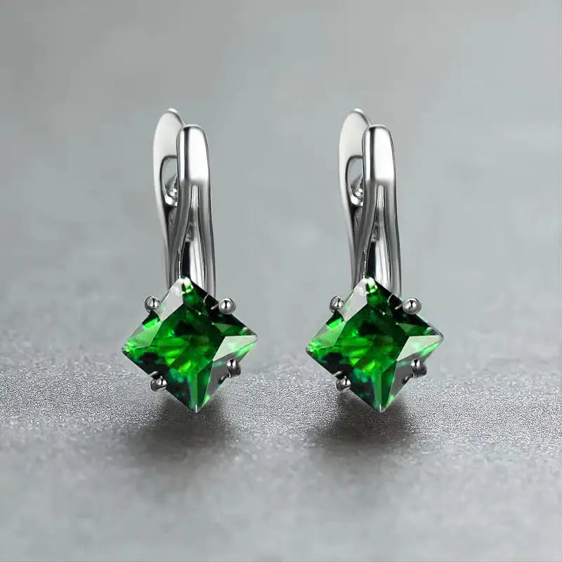 A pair of women's copper earrings with a simple diamond design and an inlaid zircon stone.