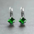 A pair of women's copper earrings with a simple diamond design and an inlaid zircon stone.