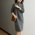 Beige half zip stand collar straight skirt with long sleeves on a mannequin