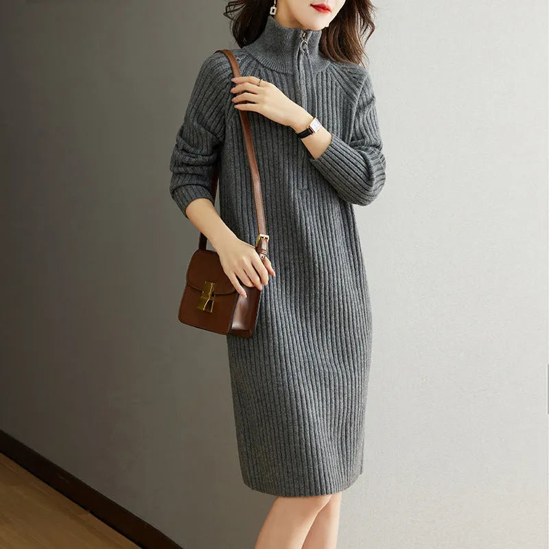 Beige half zip stand collar straight skirt with long sleeves on a mannequin