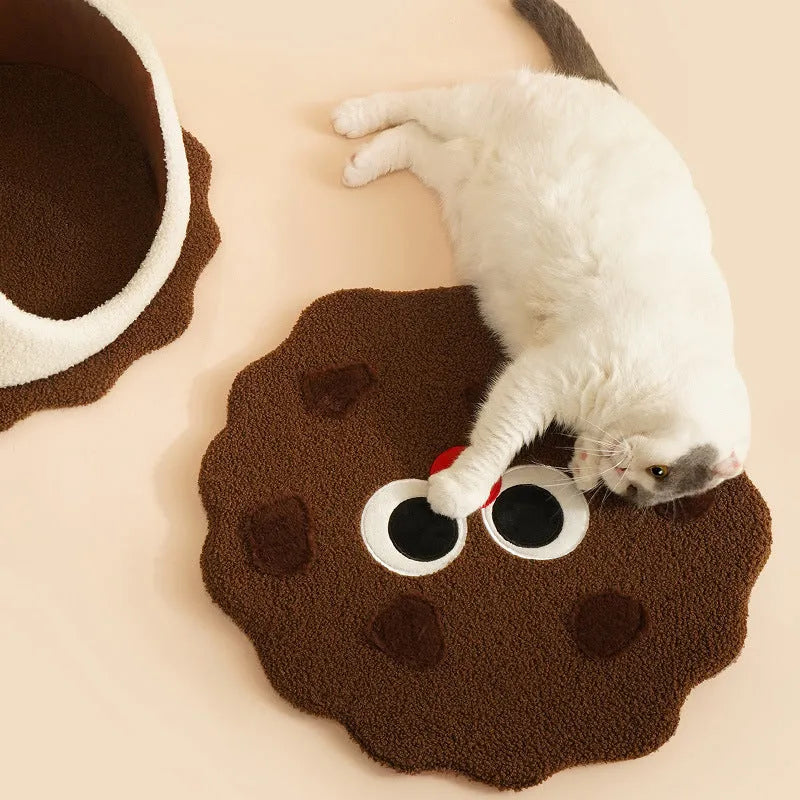 Khaki-coloured enclosed cat nest bed shaped like a sandwich cookie with a high entry wall.