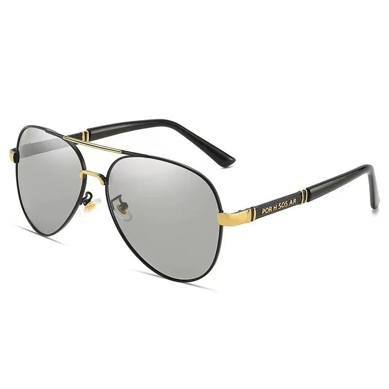 Man wearing gold metal frame polarised sunglasses with dragon decoration and grey lenses.