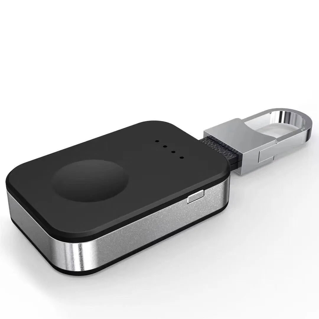 Black portable Apple Watch wireless charging power bank on a keyring.