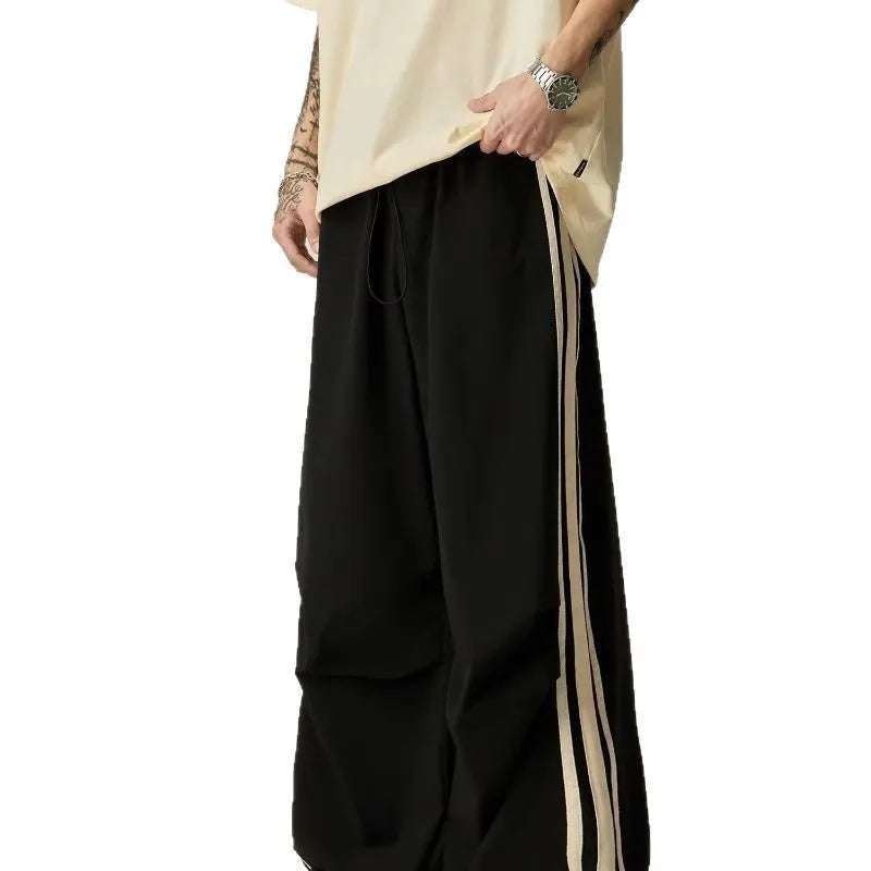 Black wide-leg climbing trousers for men with high waist and straight-leg design.