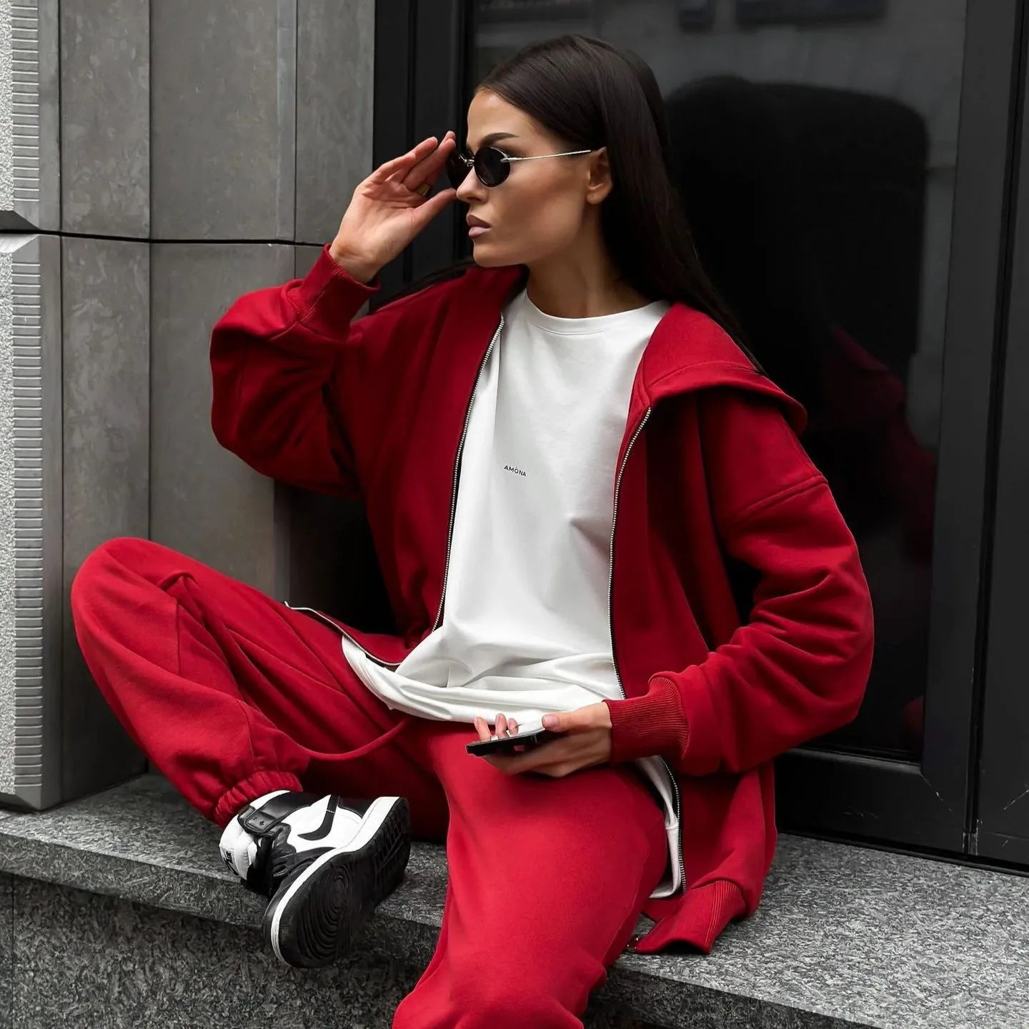 Red loose fit polyester two-piece set featuring a long-sleeved coat and matching trousers for a street style look.