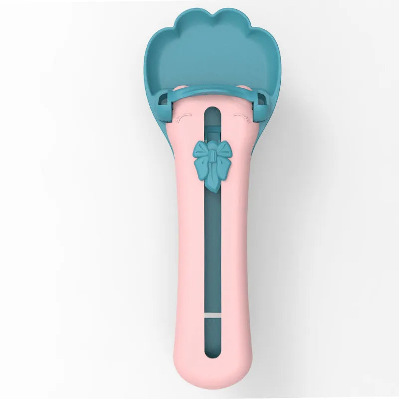 Green pet food squeezer spoon with silicone tip for dispensing liquid pet foods