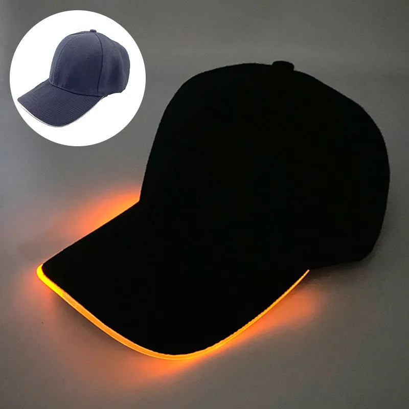 Black Halloween baseball cap with LED pumpkin smile face and yellow lights illuminated.