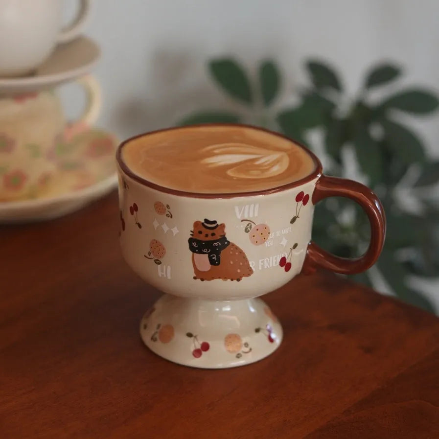 Antique caramel ceramic goblet with saucer featuring a beaming cat cartoon pattern in Autumn Squirrel colour, 250ml capacity