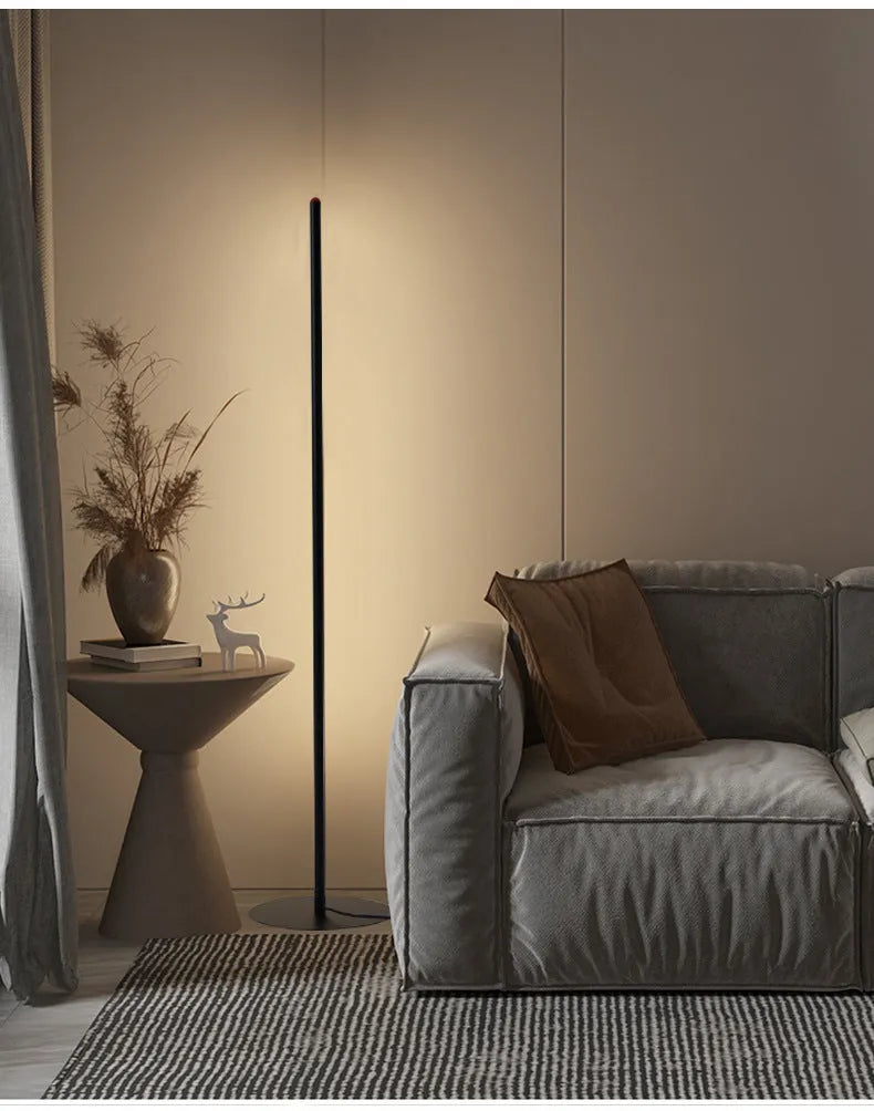 Modern simple vertical aluminium alloy floor lamp in three height sizes on a plain background.