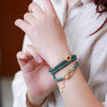 Women's blue water jade abacus beads bracelet with three tourmaline rings and pearl accents