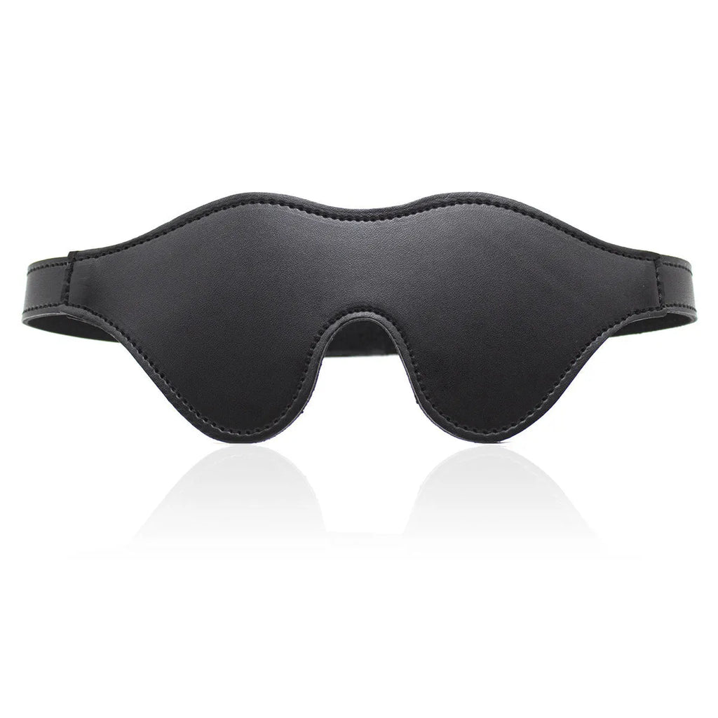 Women's black leather eye mask with 3D shape, Velcro strap, and metal rivet details.