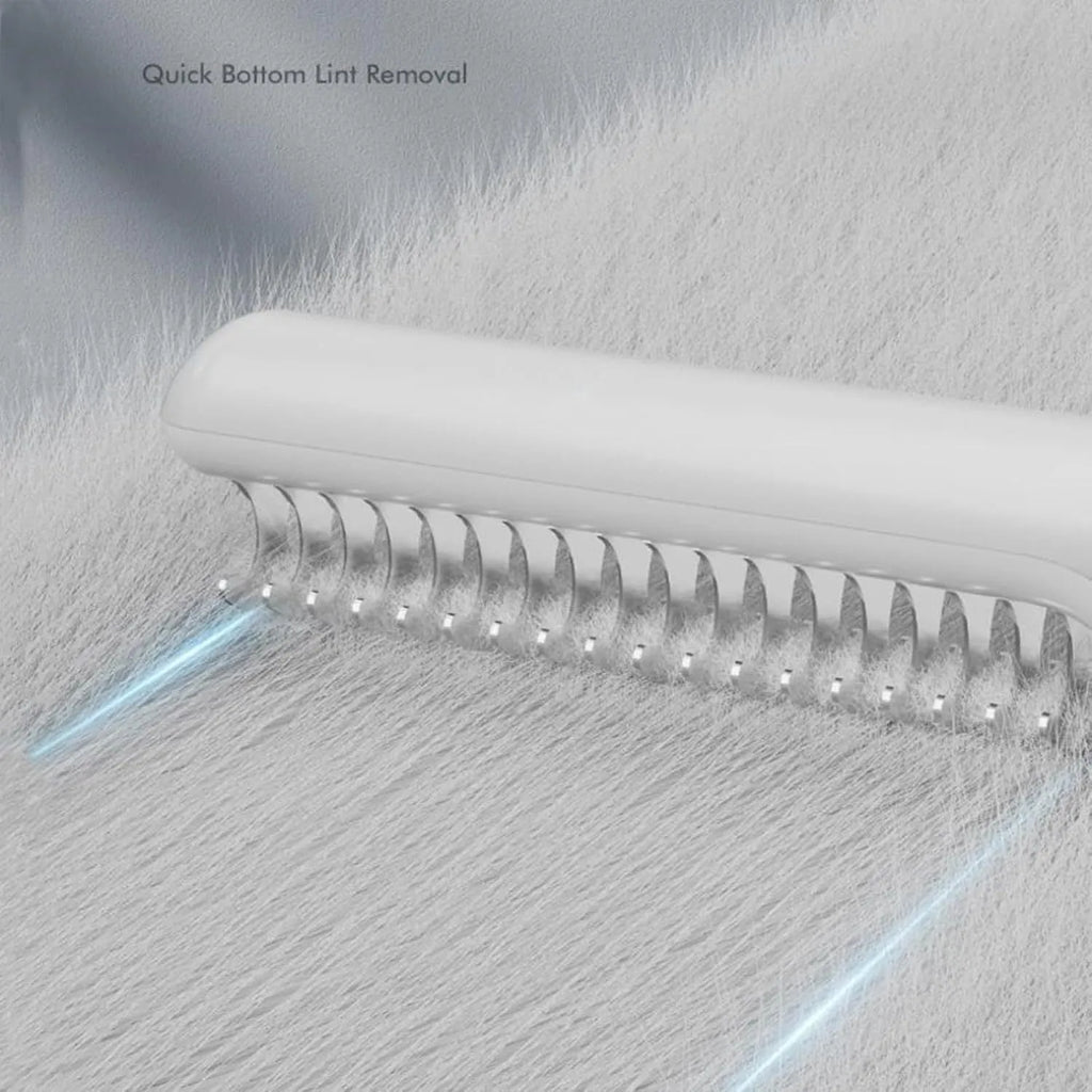Pink and white stainless steel dog dematting comb with ergonomic handle for removing hair knots and mats.