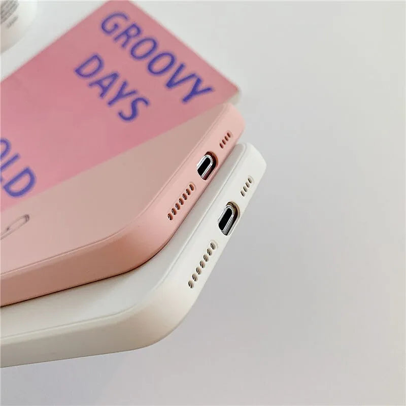 Solid colour silicone TPU phone case for Apple iPhone on a table