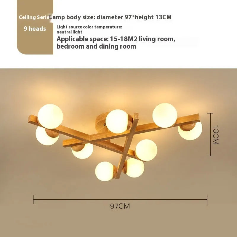 Modern Nordic-style wooden ceiling light fixture with three adjustable lamp heads mounted on a living room ceiling.