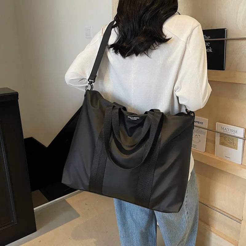 Lightweight Oxford cloth tote bag in black, grey or champagne with 20-35 litre capacity for business travel