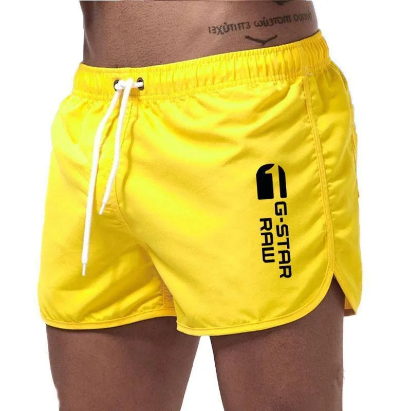 Man wearing thin polyester sports shorts with an elastic waistband in a bright colour like fluorescent green.