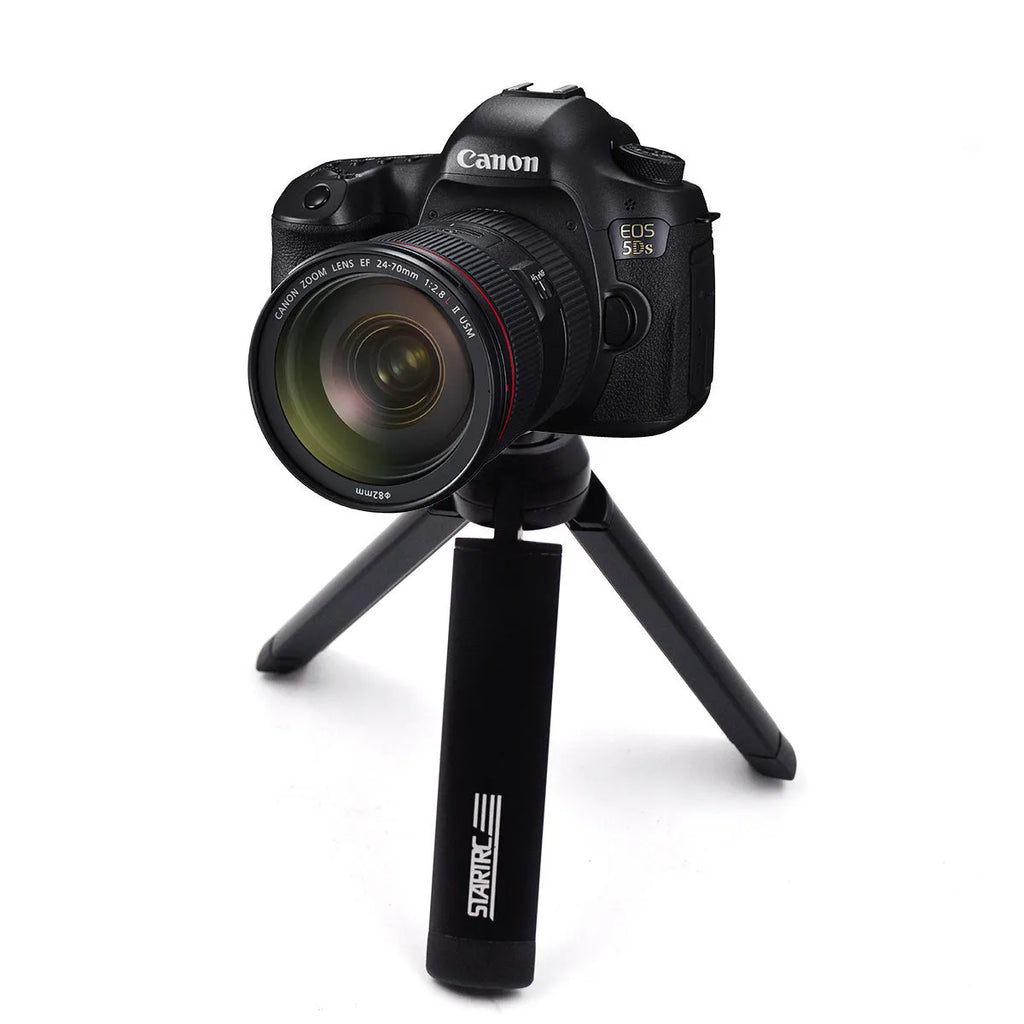 Aluminium alloy handheld bracket accessory for mounting an iPhone onto a table top tripod.