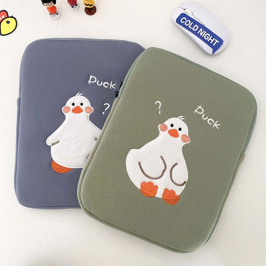 Blue cotton tablet case with embroidered cartoon duck design and a zipper closure, shown next to a green version.