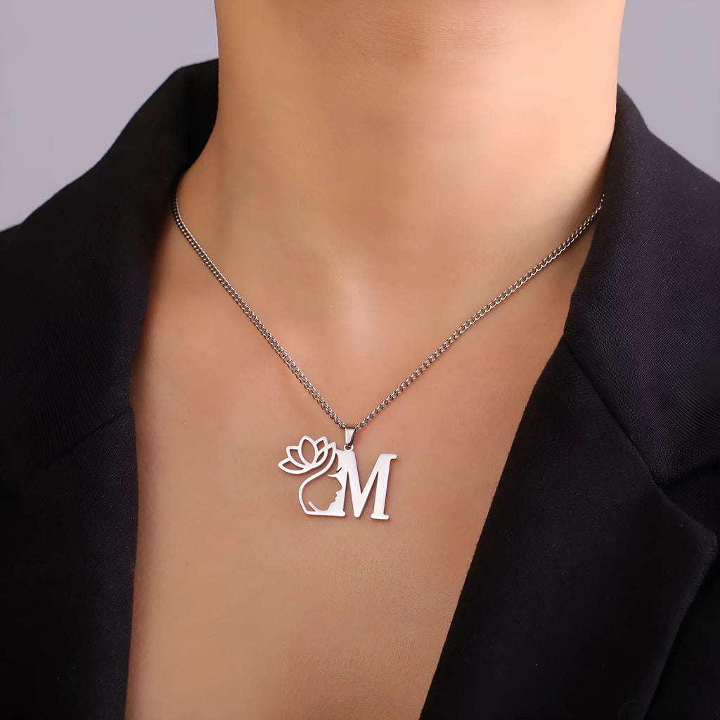 Stainless steel necklace with a cross chain and a single initial letter pendant in a gold tone.