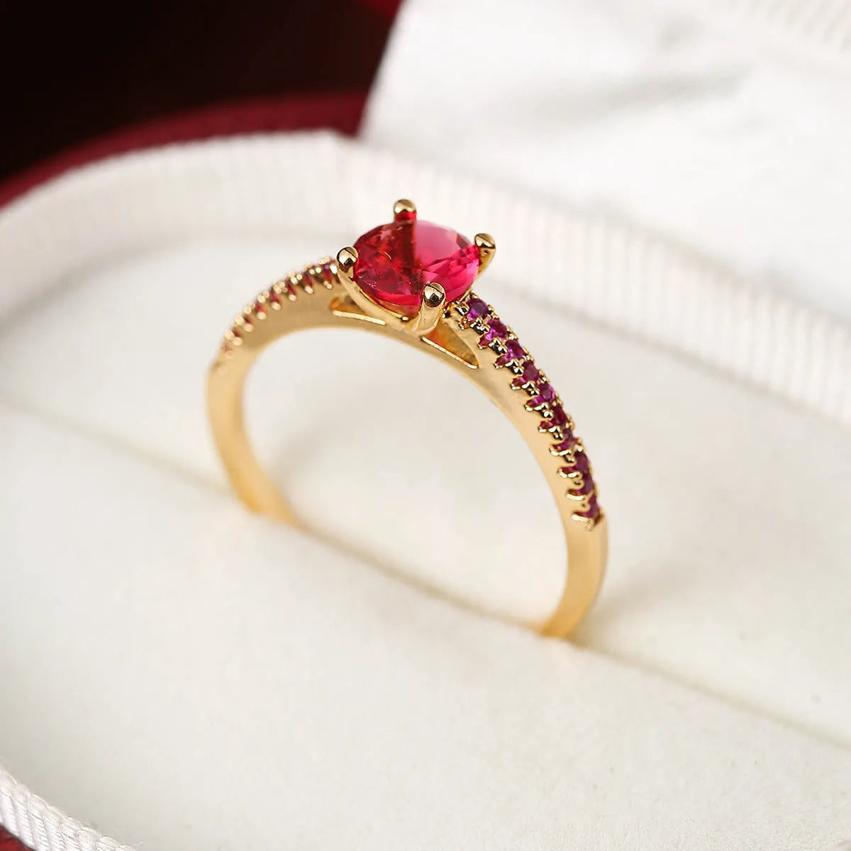 Copper zircon hexagonal geometric ring in a gold rose red electroplated finish.