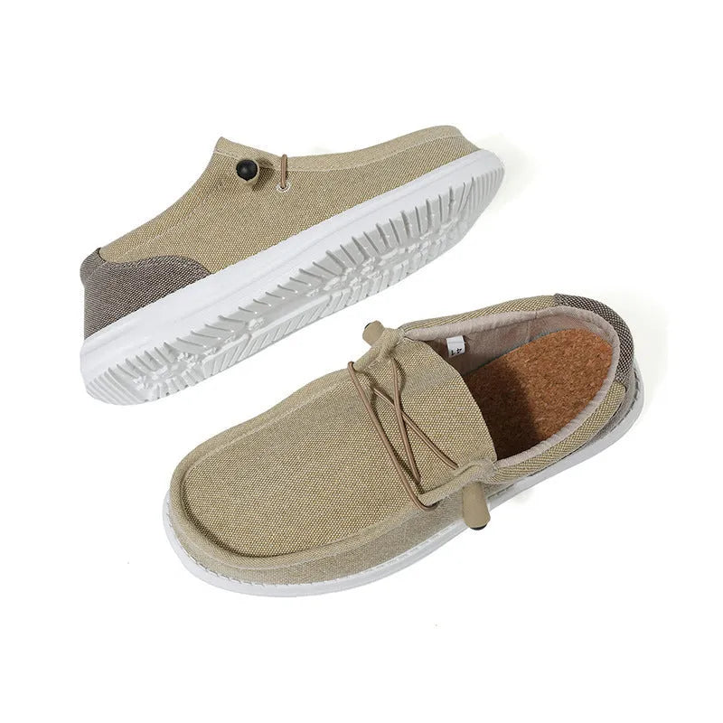 Men's casual canvas shoe in green with mosaic detail and rubber sole, shown from the side.
