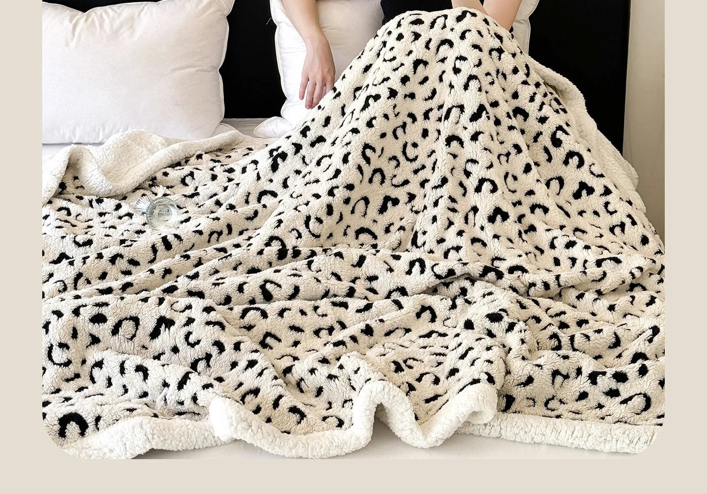 Double-layer cationic jacquard taffeta blanket with leopard print pattern in camel colour.