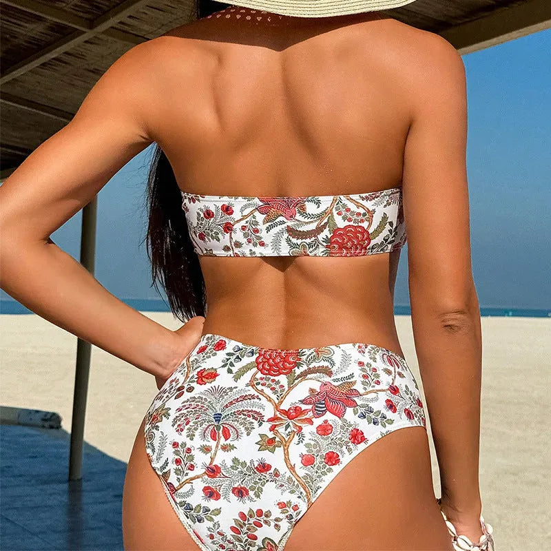 Women's printed bandeau triangle top and matching swim shorts set on a beach background