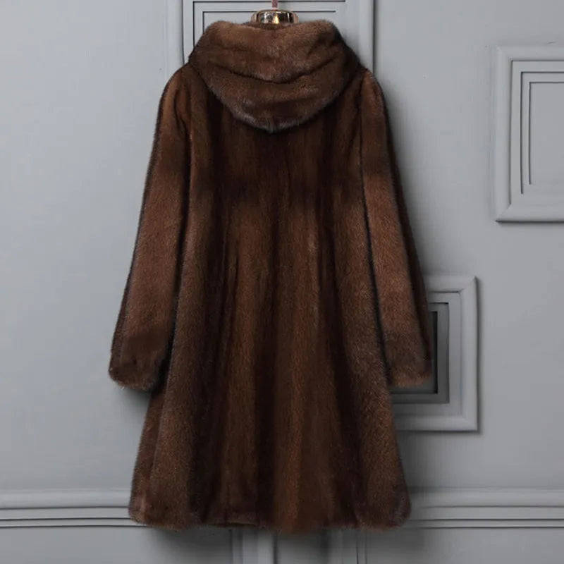 Women's long black faux fur hooded coat with street fashion style.