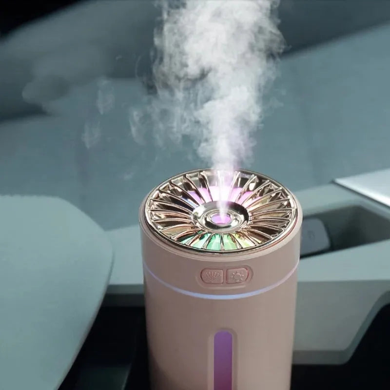 Black USB car humidifier with LED lights placed in vehicle cup holder showing mist output