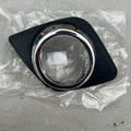 Black anti-fog light cover trim piece for Toyota RAV4 front bumper.