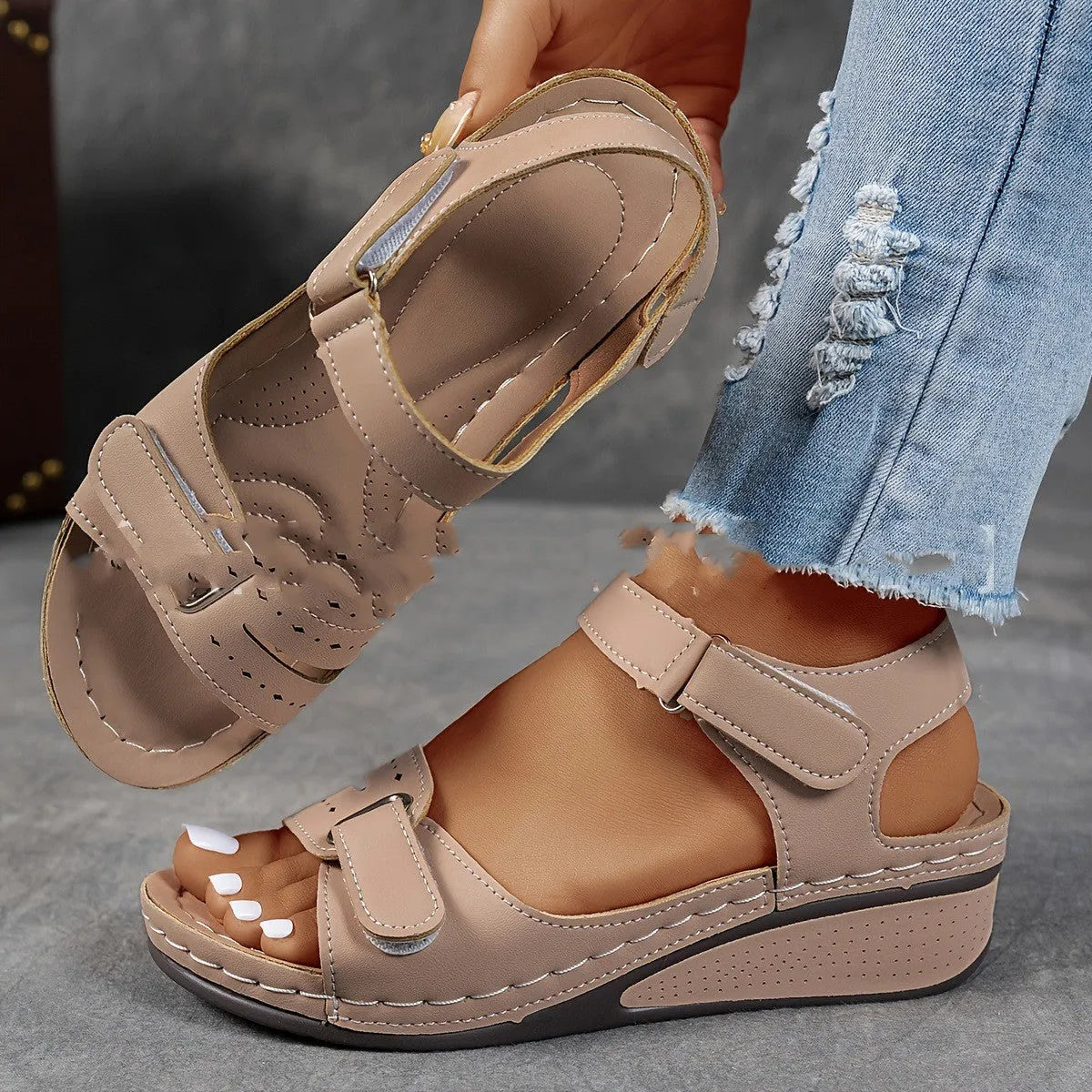 Women's beige strap sandals with thick composite sole and adjustable Velcro fastener on a white background.