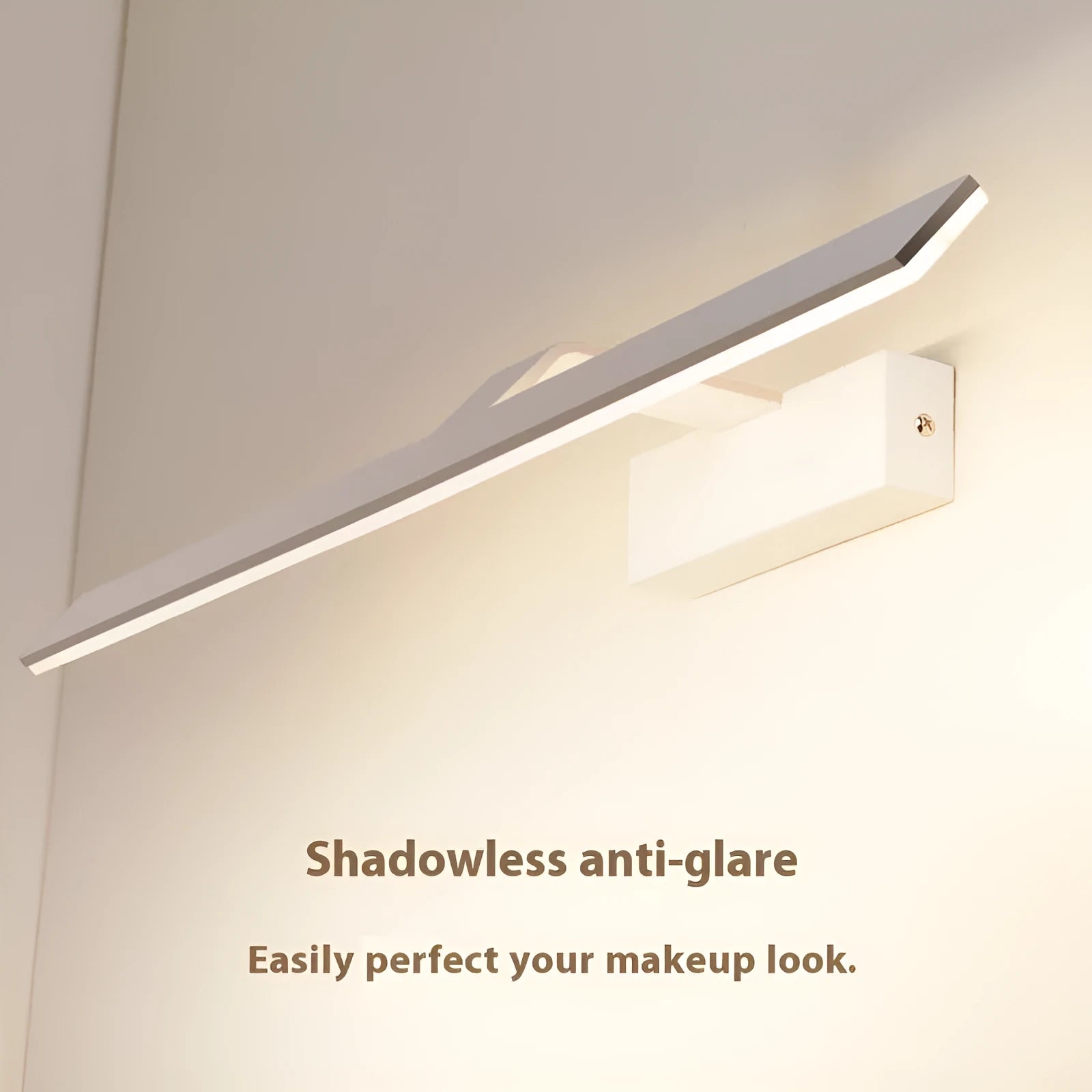 White LED strip light mounted above a bathroom mirror, showing slim profile and even illumination.