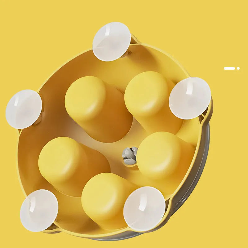 Yellow plastic cat entertainment plate with snack storage compartments and dispensing channels