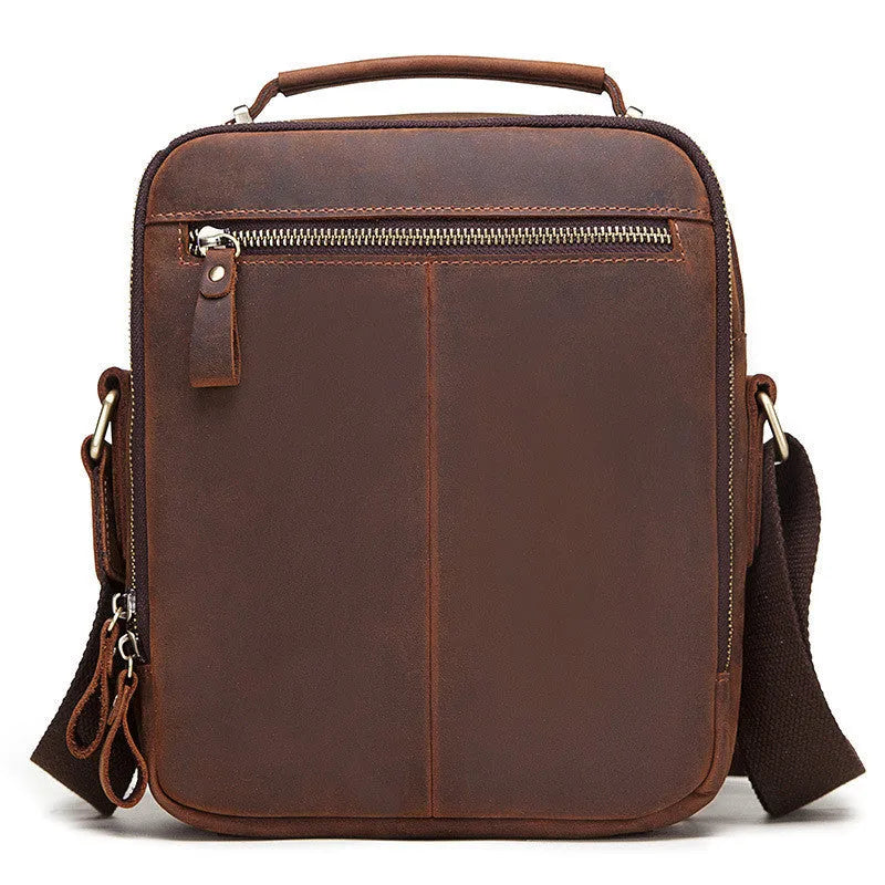 Men's brown Crazy Horse leather crossbody bag with visible sewing lines and adjustable shoulder strap