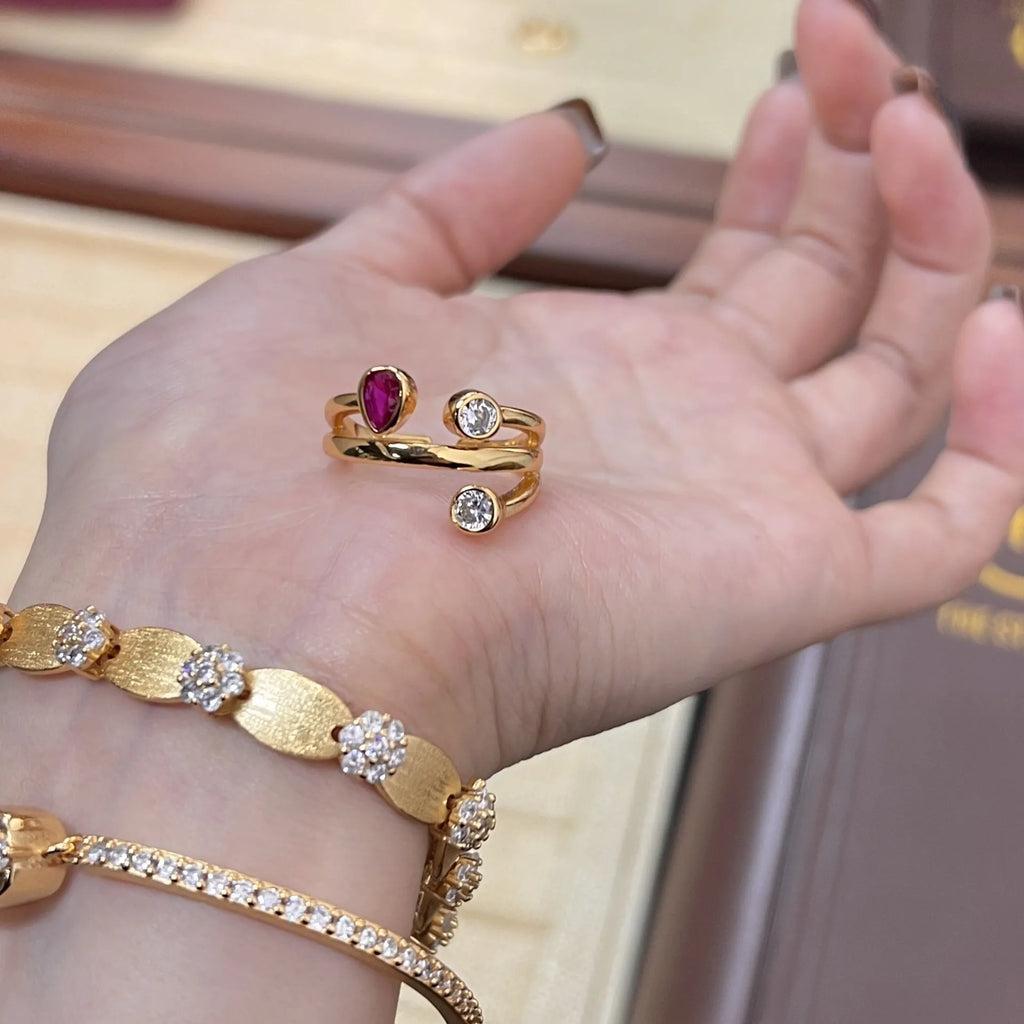 Double-headed copper ring with irregular geometric cross design and group diamonds in two-tone colours.
