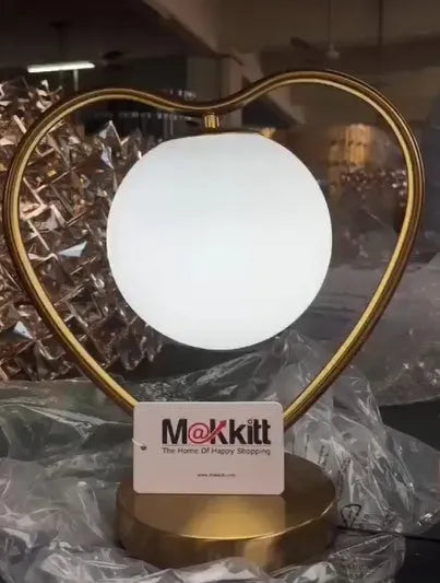 Heart shaped decorative lamp with a warm soft glow on a surface