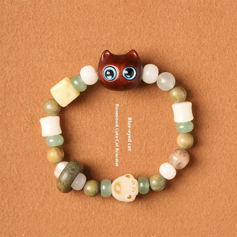 Hand-woven beaded bracelet with a cat's paw charm, jade, and wood beads in a cartoon style.