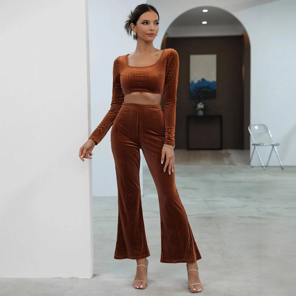 Caramel coloured long sleeve sweater and matching trousers set on a hanger.