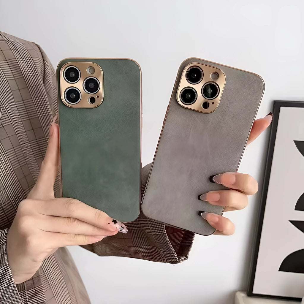 Leather texture TPU phone case for iPhone on a table, showing grey-green colour and precise camera cutouts.
