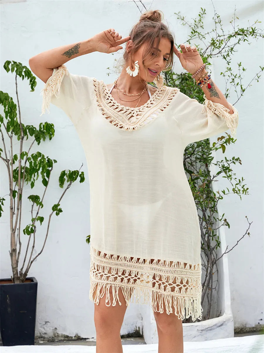 Apricot hand-crocheted beach dress with openwork pattern and lining, shown as swimsuit cover-up