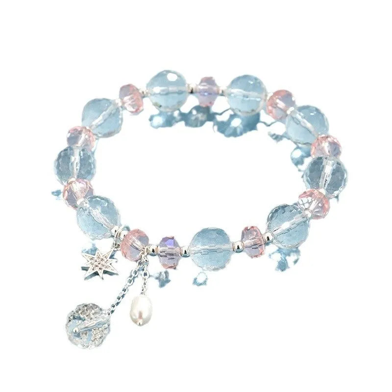 Women's white crystal bracelet with lucky cat charm and diamond-shaped stones on adjustable electroplated band
