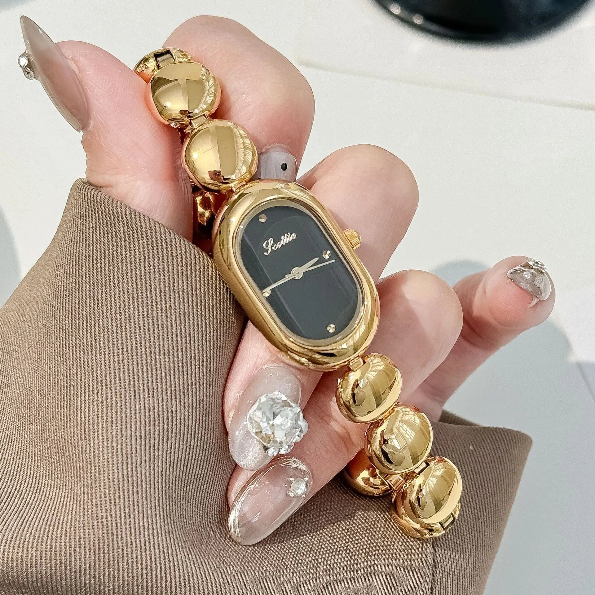 Women's oval fashion watch with bracelet strap in one of seven colour options.