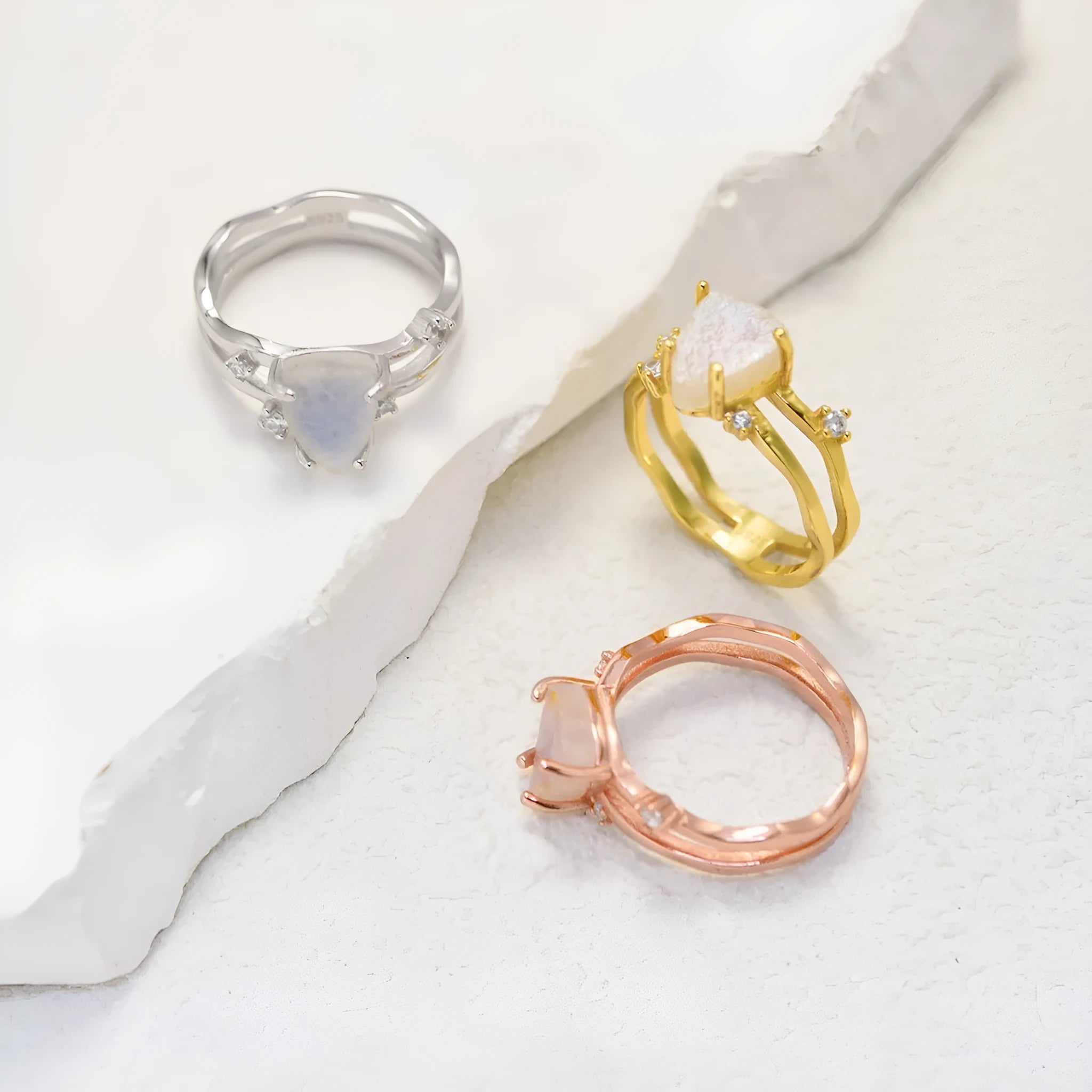 S925 sterling silver moonstone ring with irregular triangle geometry on model finger